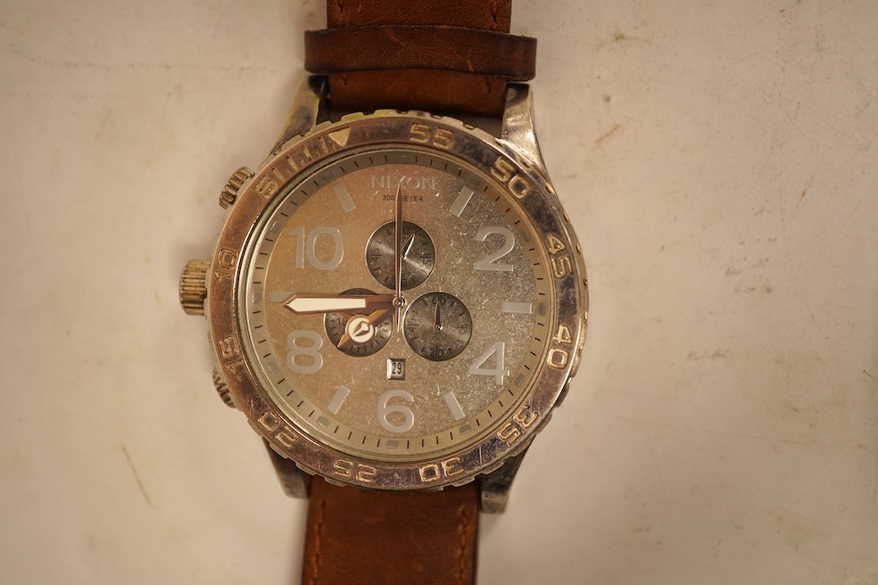 A large Nixon SI-30 stainless steel gentleman's chronograph wristwatch and nine various quartz wristwatches including Seiko.